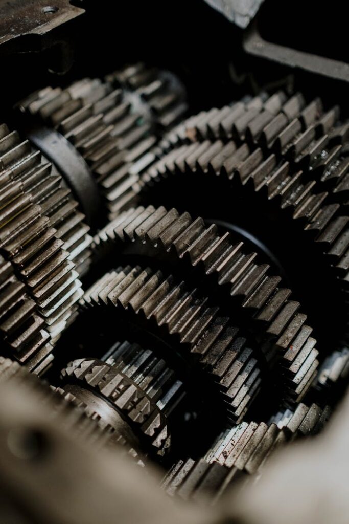 pexels-photo-7568427 Detailed close-up of metal gears inside a machine showcasing precision engineering.